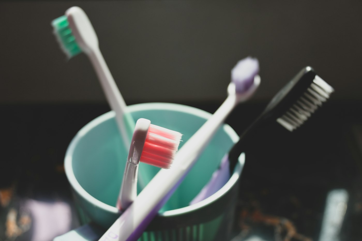 Two toothbrushes standing in a cup