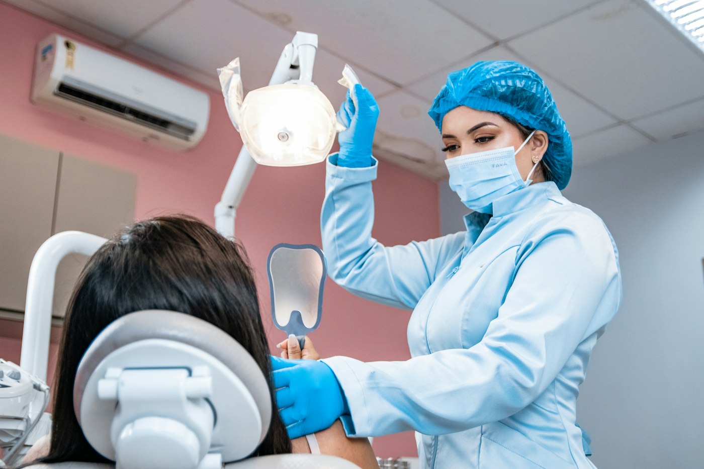 Dentist examining a patient's teeth and gums