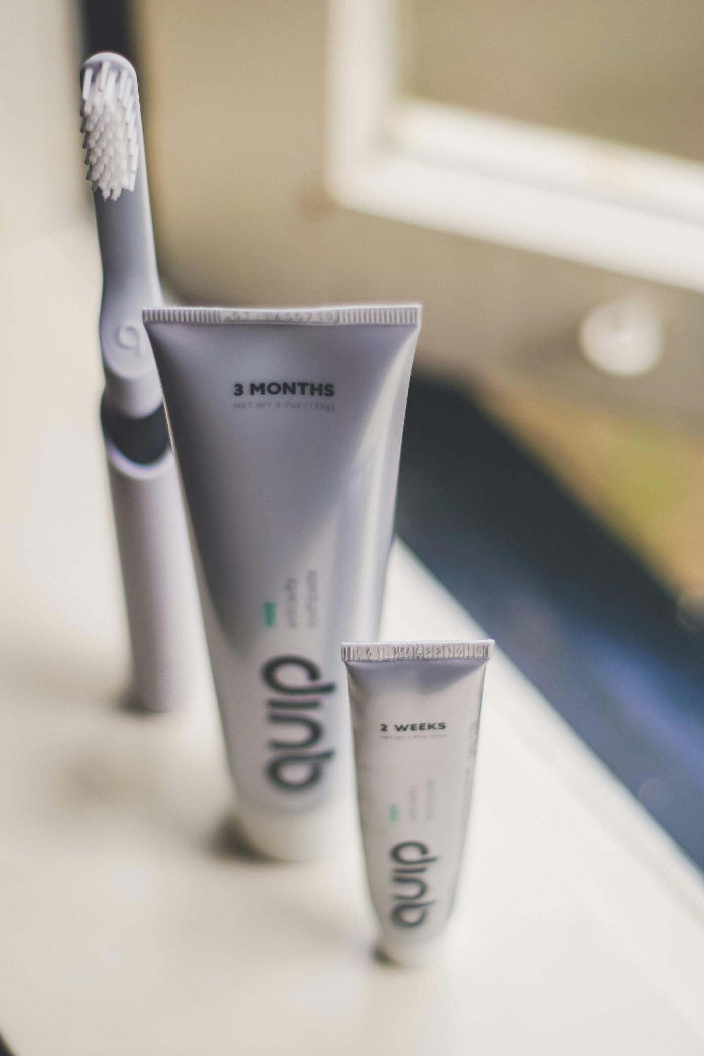 A toothbrush and a tube of toothpaste