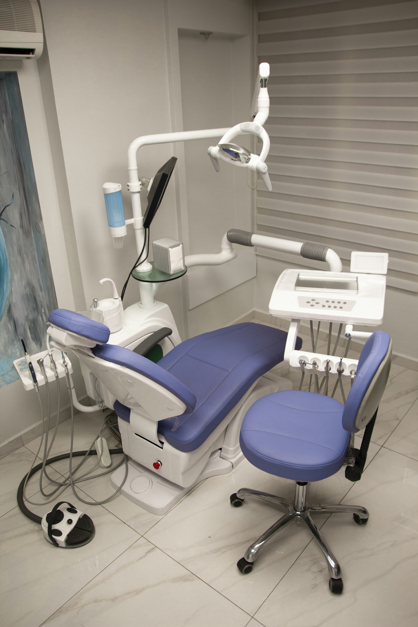 Treatment room with a dental chair at a modern clinic