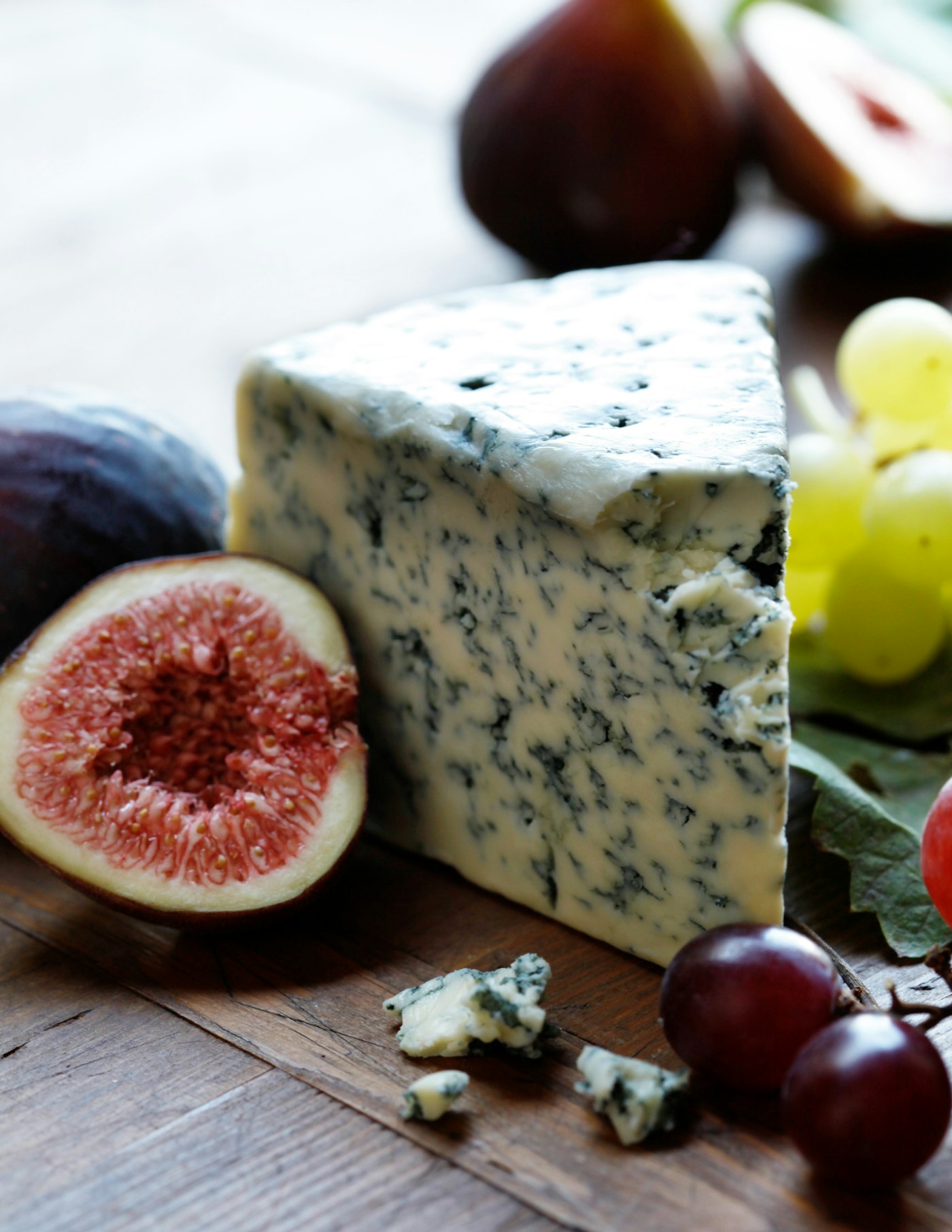 Fruits and cheese on a wooden board