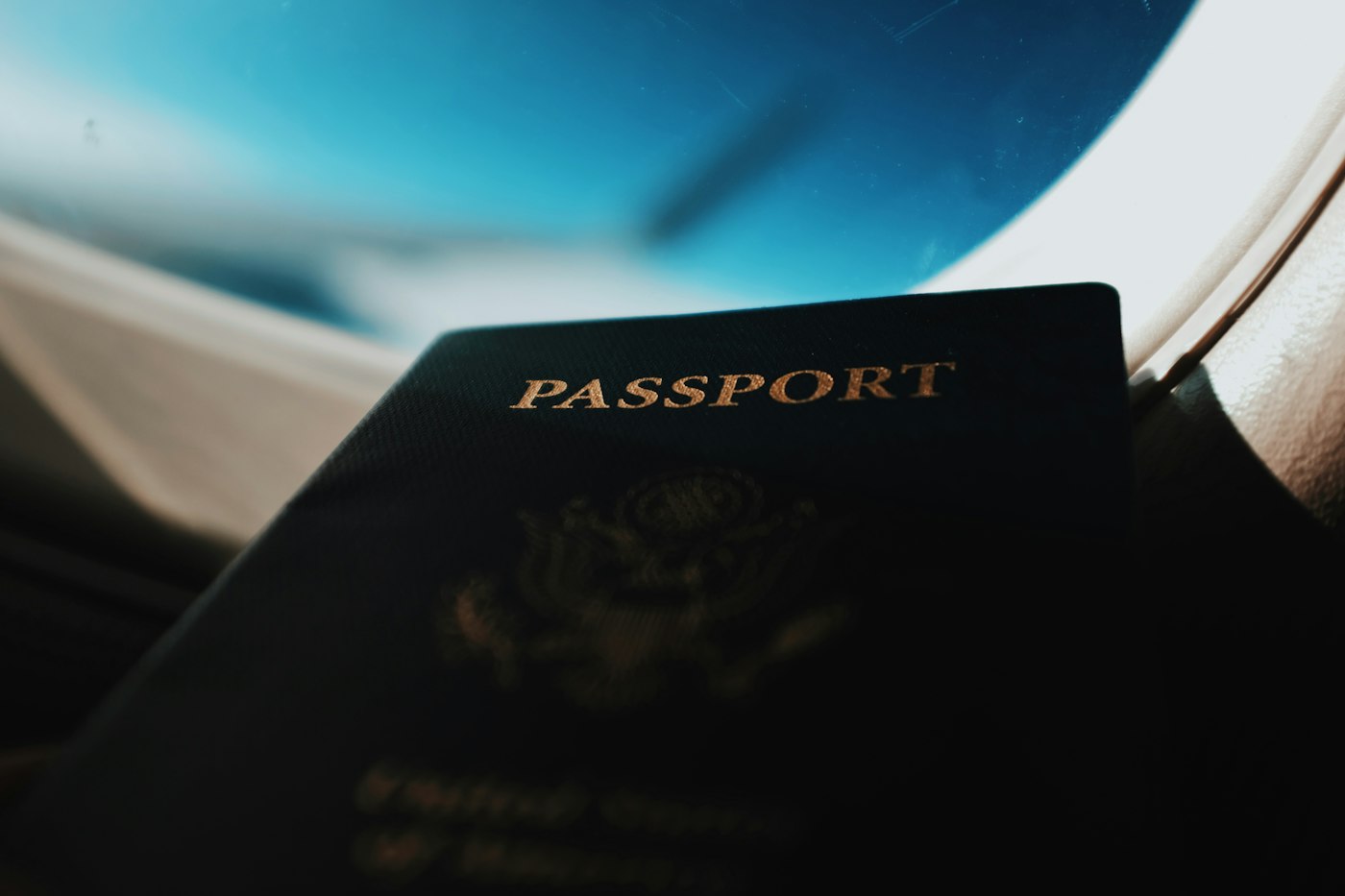 Passport held against an aeroplane window